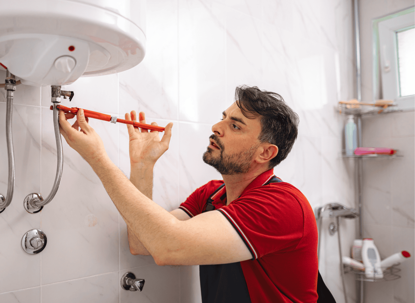 Licensed plumber connecting water heater supply lines