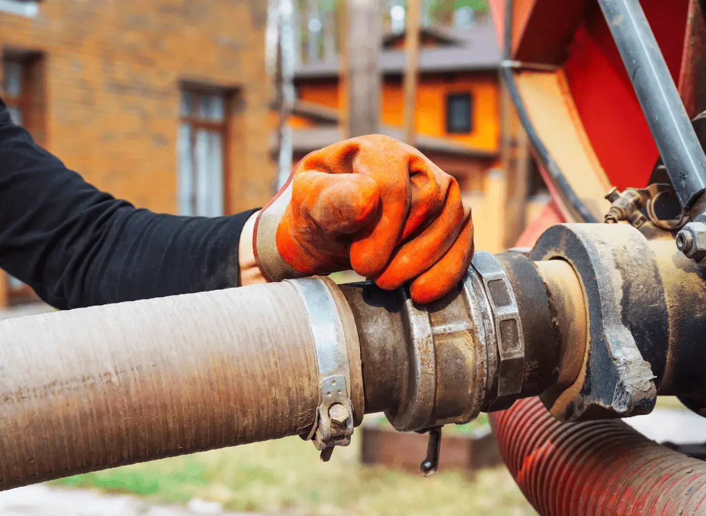 Licensed plumber installing sump pump discharge line