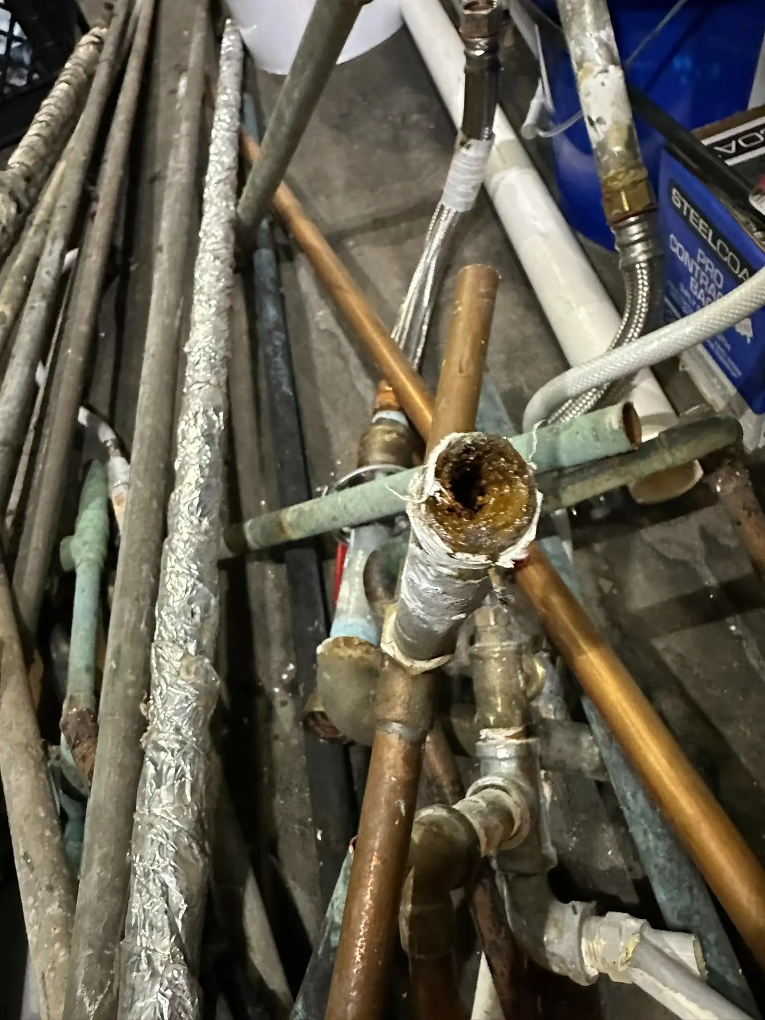 Leaking pipes in a Valparaiso home showing signs of wear and potential water damage.