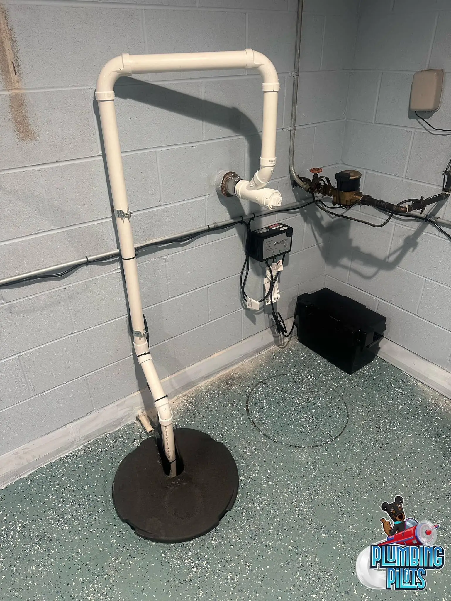 Battery backup sump system installed near sump pit