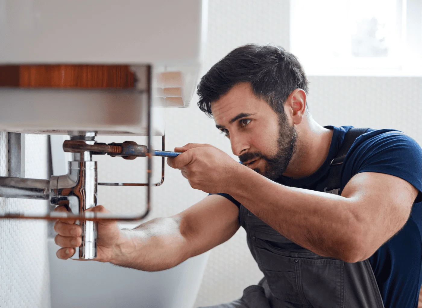 Licensed plumber connecting water heater shutoff and safety valve